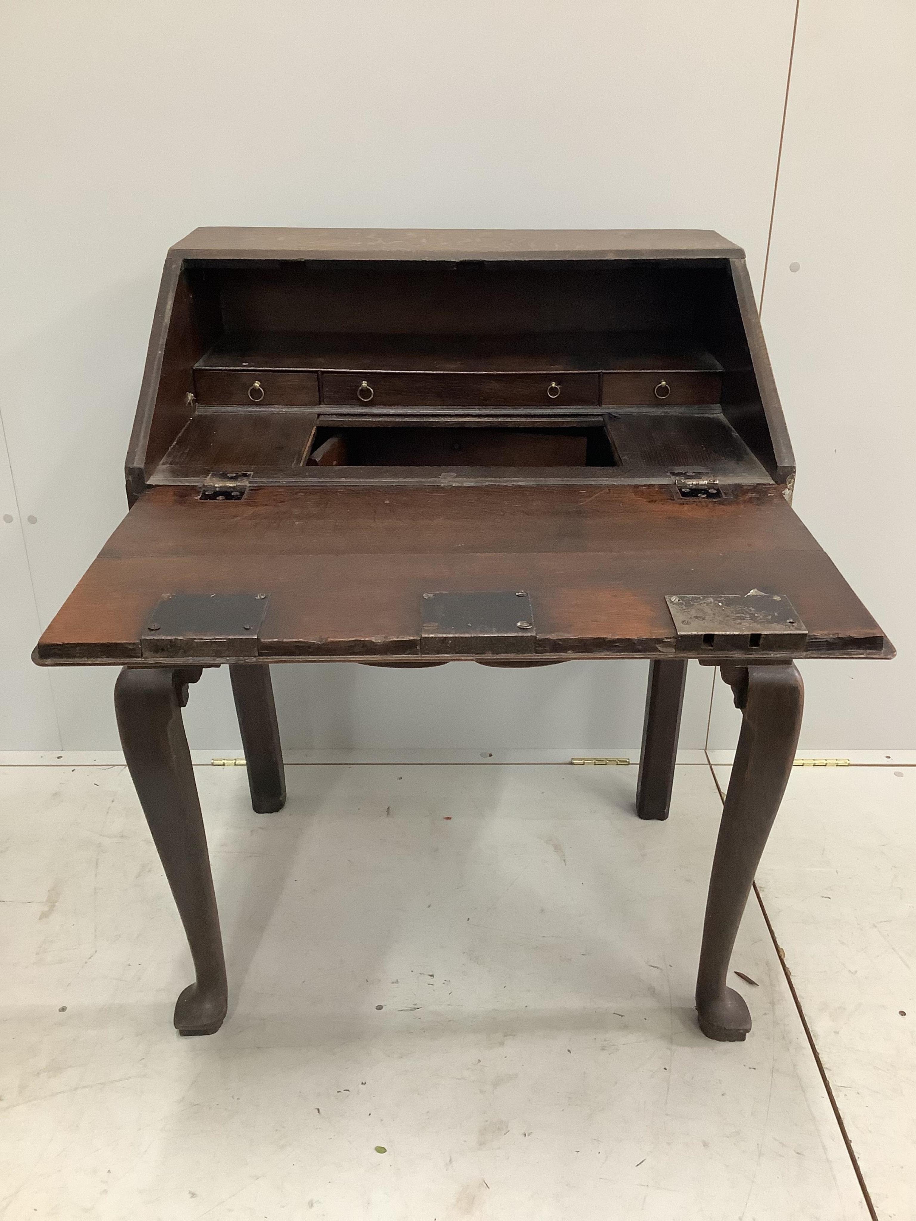 A late 18th century oak bureau on stand, width 78cm, depth 54cm, height 97cm. Condition - fair